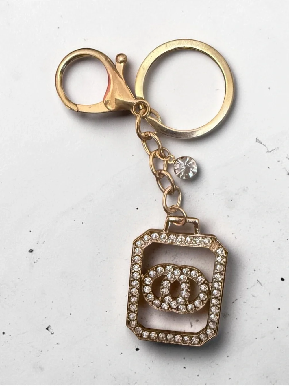 Gold Crystal Keychain Charm with Interlocking Rings Accent